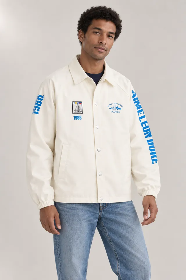 Veste Aimé Leon Dore à inscription MARINA blanc cassé et bleue