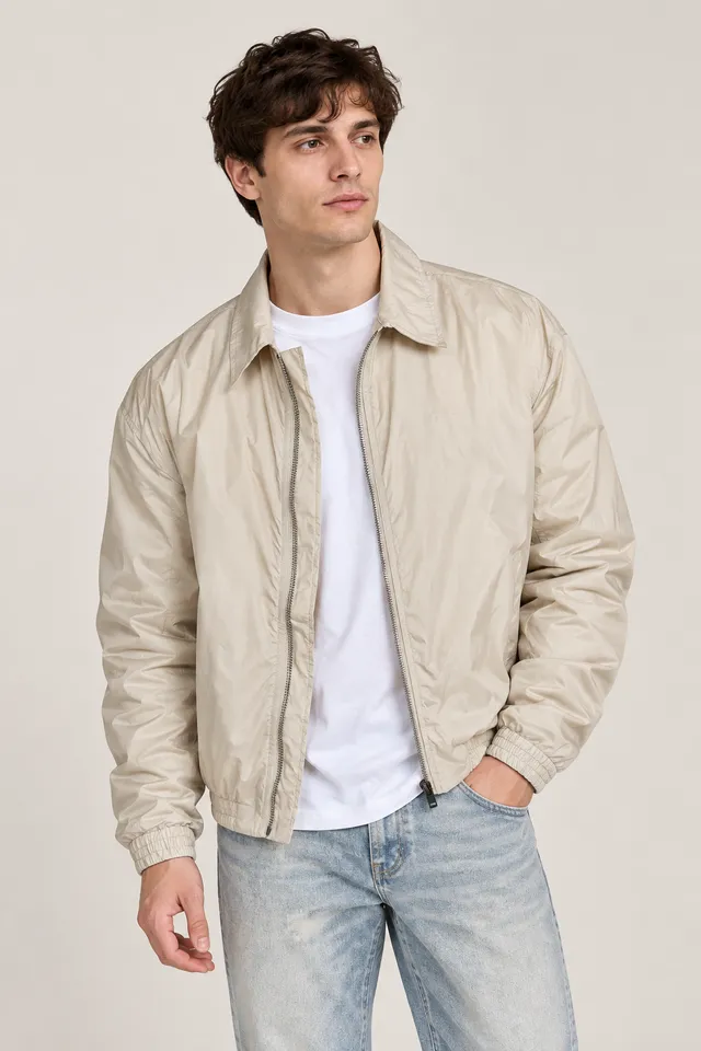 Veste Acne Studios beige clair à inscription STOCKHOLM 1996 au dos, Porté de face