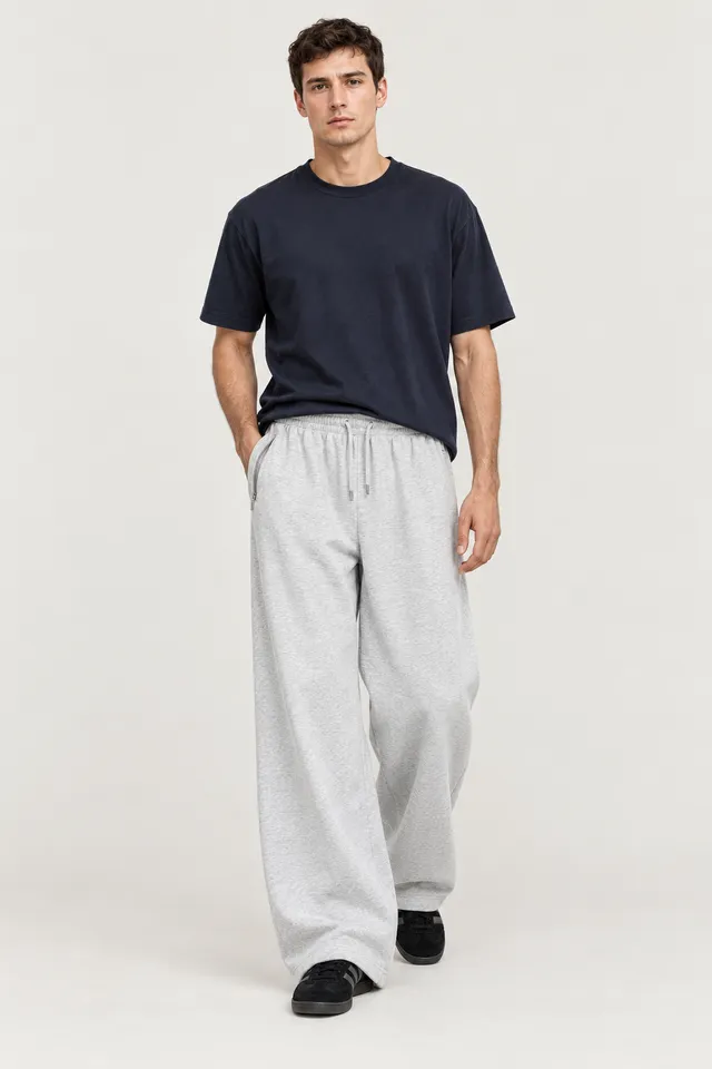 Pantalon Acne Studios gris clair à coupe large, Porté de face