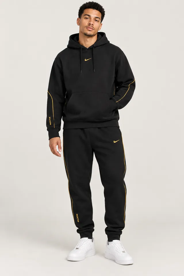 Ensemble Nike NOCTA noir à détails dorés
