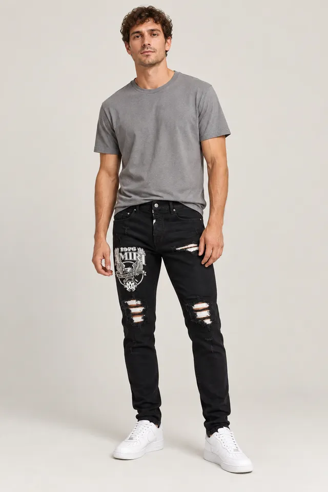 Jean Amiri skinny noir à aigle brodé, Porté de face